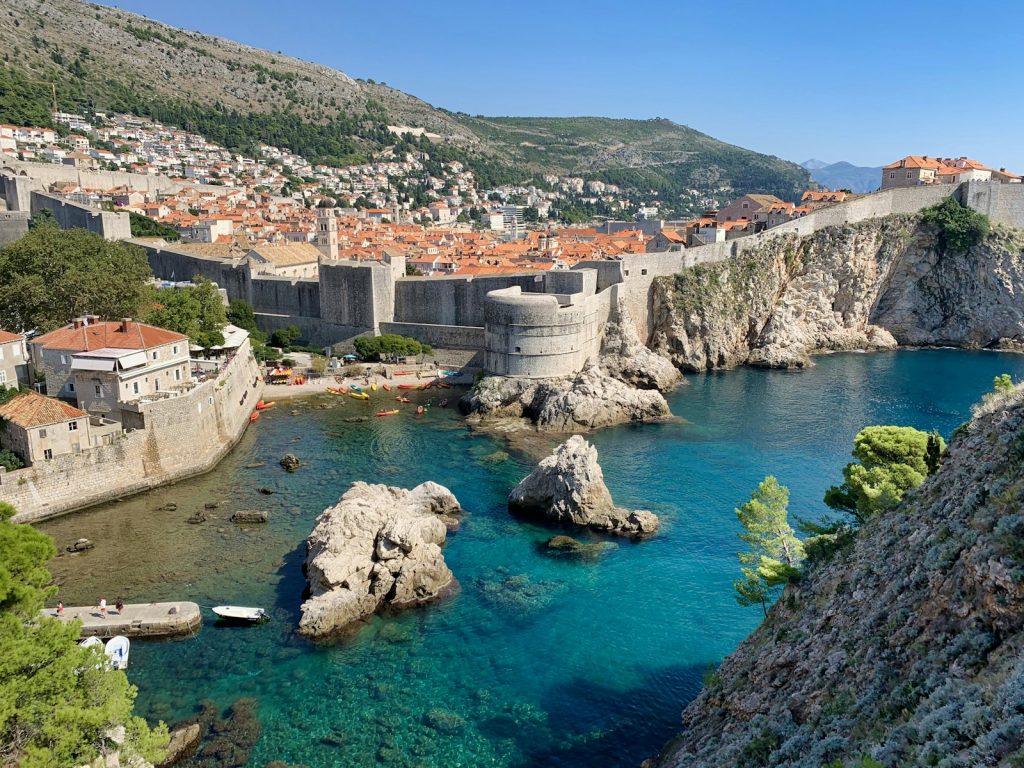 white and brown concrete building near body of water during daytime dubrovnik