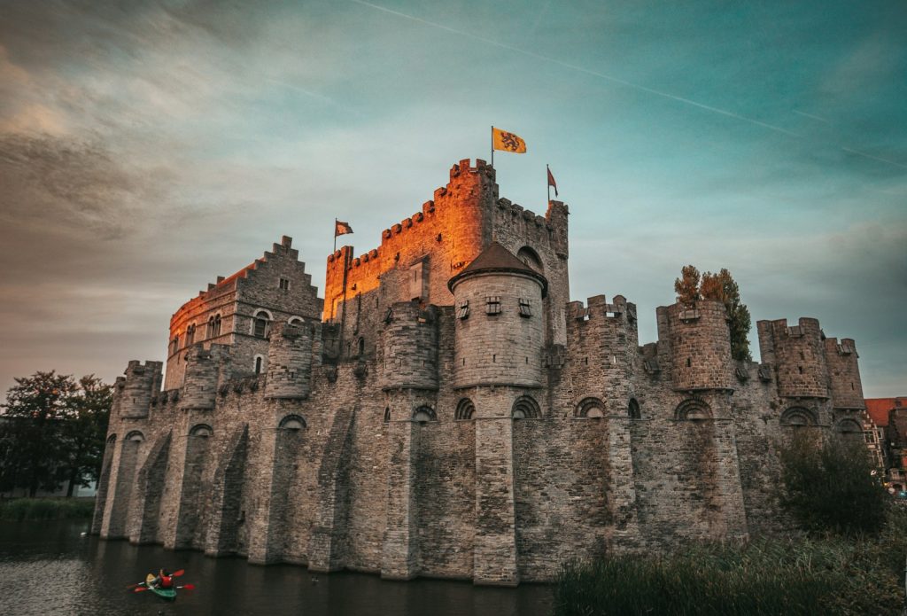 a castle with a moat gravensteen gent kasteel