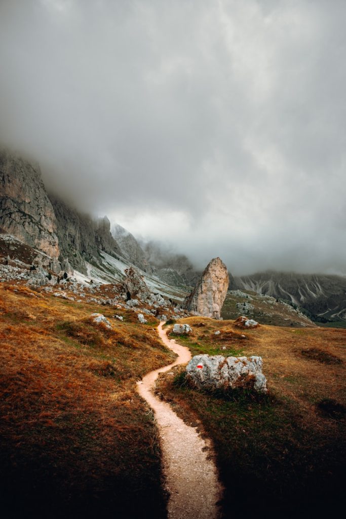 brown and gray rocky mountain under white sky during daytime val gardena