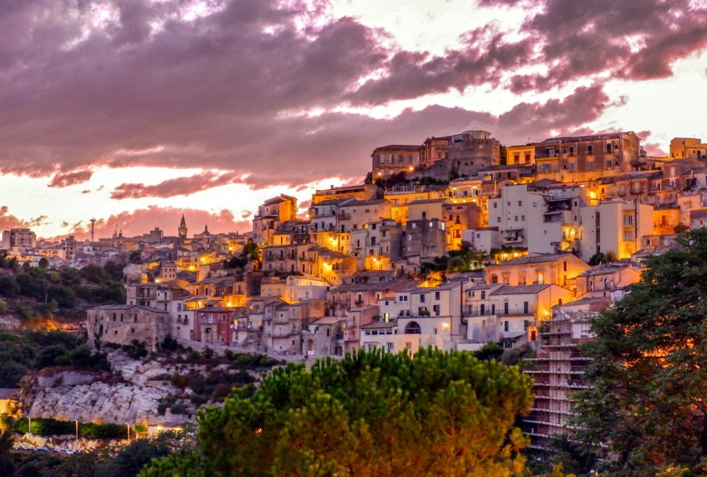 white and brown ragusa concrete buildings under white clouds during daytime