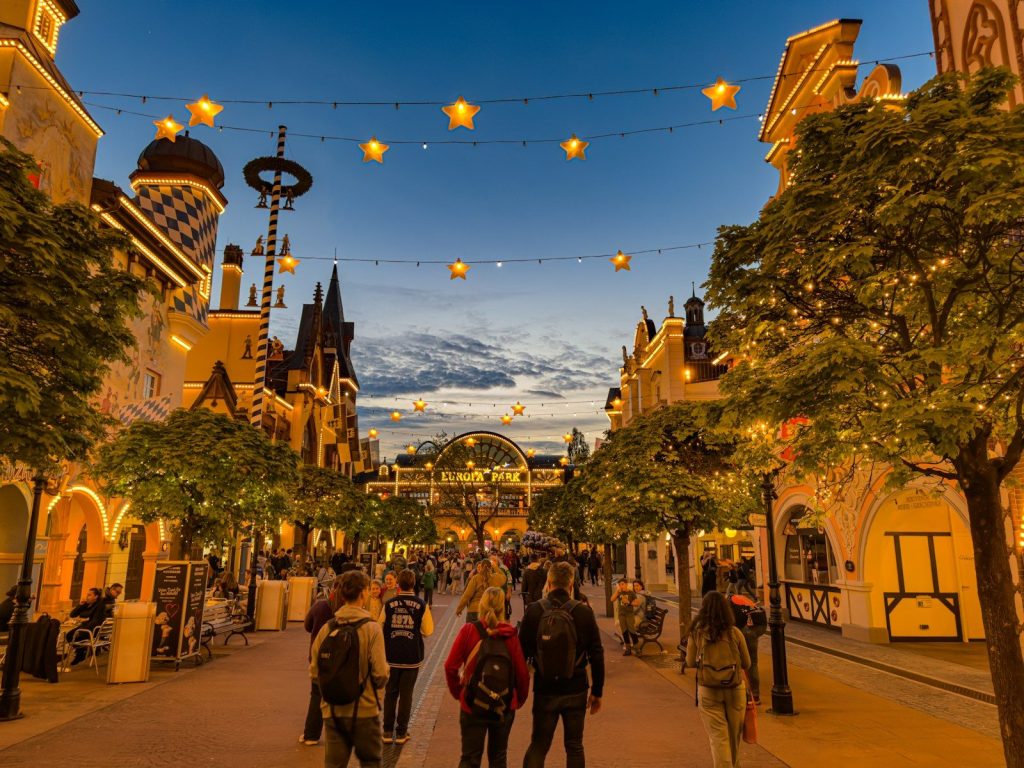 A festive street at dusk with decorative lights halloween in europa-park 2026